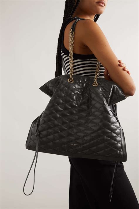 SAINT LAURENT Quilted leather drawstring shoulder .